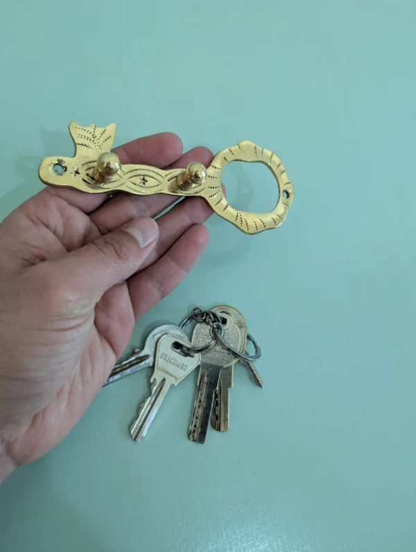 Add a touch of magic to your home decor with this unique brass key holder. - Image 2